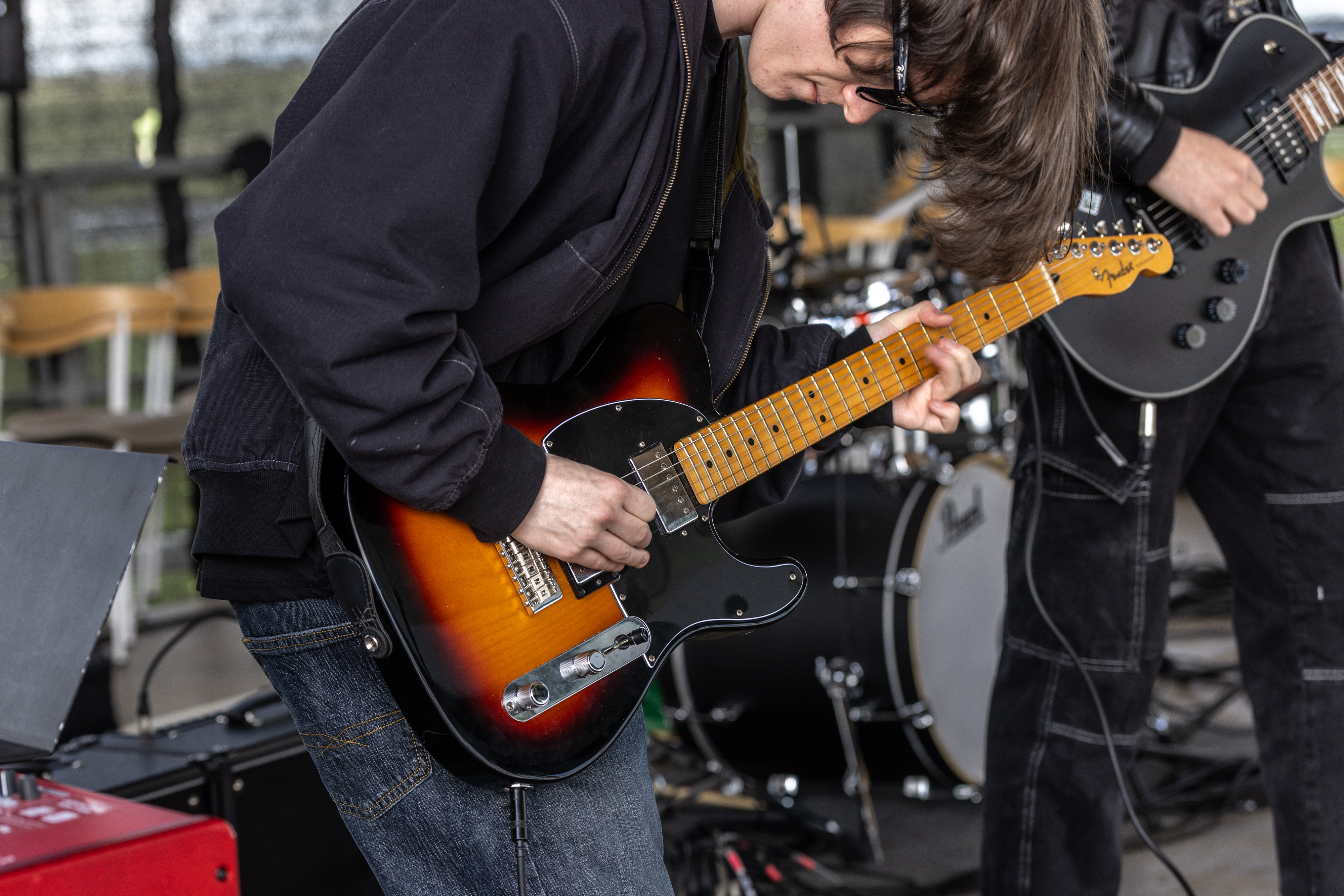 Person playing guitar. 